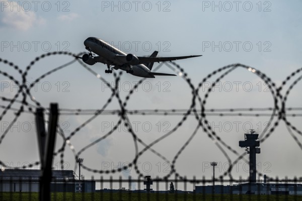 Symbolic image security at the airport, outer fence at Düsseldorf International Airport, steel wire