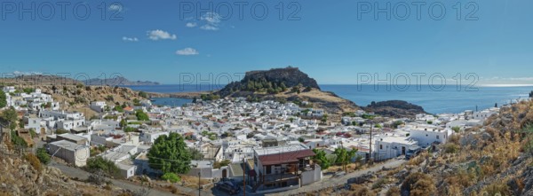 Panoramic view of the town of Lindos with Acropolis on the coast with a blue sky, Acropolis,