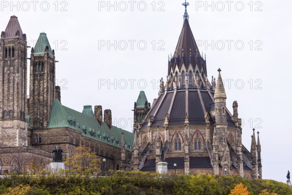 The Canadian Parliament Buildings with Gothic architecture, featuring towers and a prominent spire