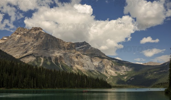 Serene mountain view of the Canadian Rocky Mountains with clear Emerald Lake reflecting a dramatic