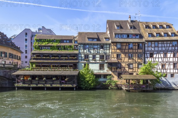 Idyllic waterside impression around a district named Petite France in Strasbourg, a city at the