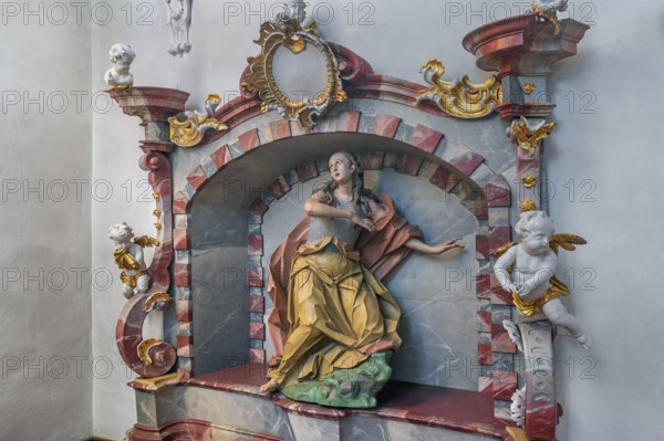 Church of St Gallus and Ulrich, niche with female figure of a saint and putti, Kisslegg, Allgäu,
