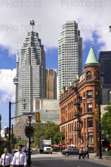 A mix of historic and modern buildings under a bright sky in Toronto, Ontario, Canada, North