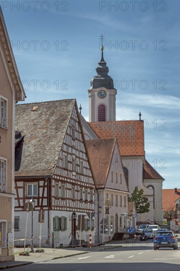 Pointed gable house with half-timbering and St Gallus and Ulrich church, Kisslegg, Allgäu,