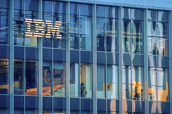 Jan 16, 2025 - Lisbon, Portugal: Day view of IBM office building with glowing logo and sleek glass