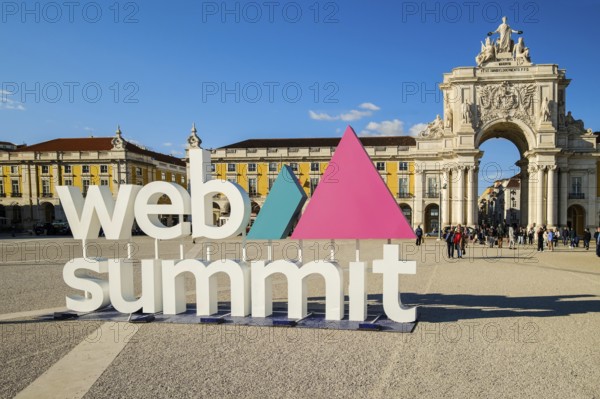 Nov 13, 2024 - Lisbon, Portugal: Web Summit sign displayed at Commerce square on sunny day under