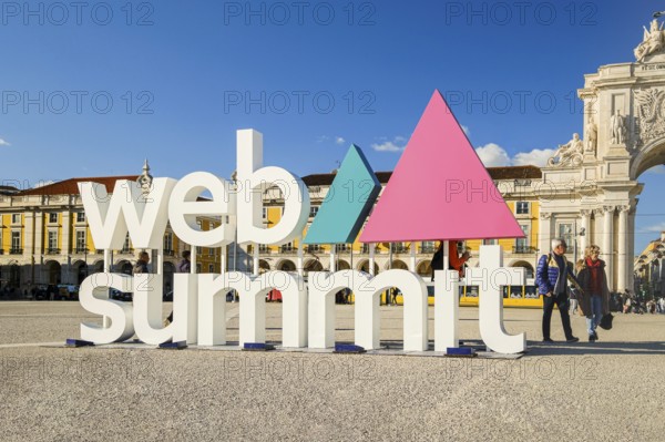 Nov 13, 2024, Lisbon, Portugal: Colorful Web Summit sign against classic architecture of Praca do
