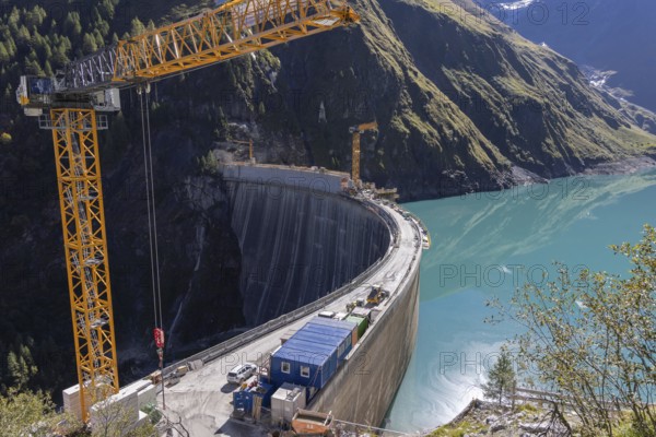 Waterfall bottom reservoir, dam wall, construction site, mountain panorama, energy industry, hiking