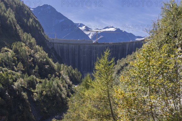 Waterfall bottom reservoir, dam wall, construction site, mountain panorama, energy industry, hiking