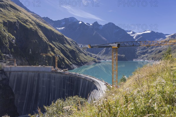 Waterfall bottom reservoir, dam wall, construction site, mountain panorama, energy industry, hiking