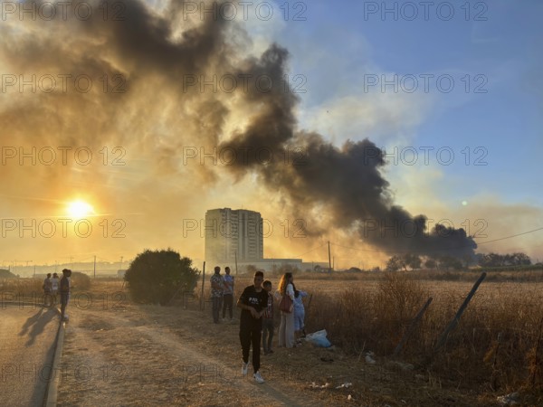 Faro, Algarve - September 21, 2025: People watching a big fire in the suburbs of Faro, capital city