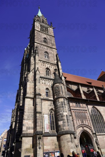 Noble Gothic church with impressive façade and bright blue sky in the background, Church of St.