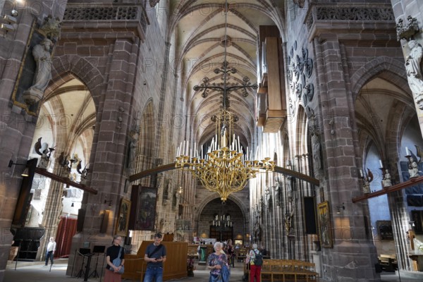 Spacious church interior with high vaults and magnificent chandelier, St. Lawrence Church,
