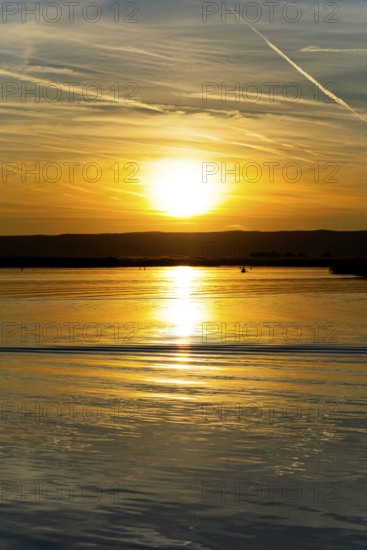 Lake Neusiedl, Burgenland, Austria, Europe, Sunset paints the sky in vivid colours while the water