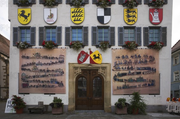 Historical depiction of a folk festival procession, coat of arms, at the town hall, Bad Cannstatt,