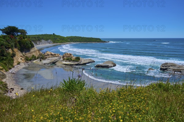 Coastal landscape with waves, rocks and blue sky, Cape Foulwind, West Coast, South Island, New