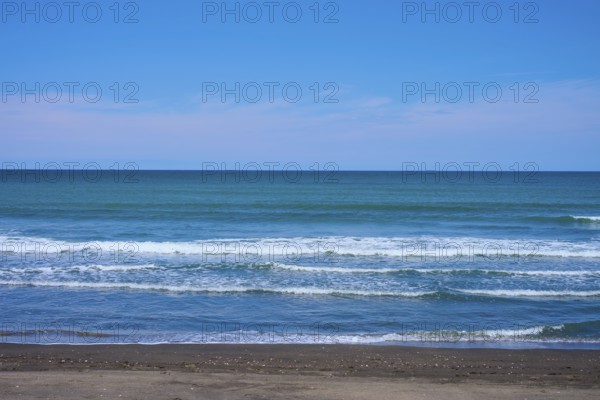 Calm beach with gentle waves on the blue horizon, Mana Bay, Patea, Taranaki, North Island, New