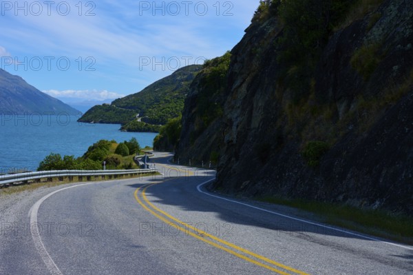 Winding road leads through remote landscape along a lake, Devil's Staircase Lookout Point,