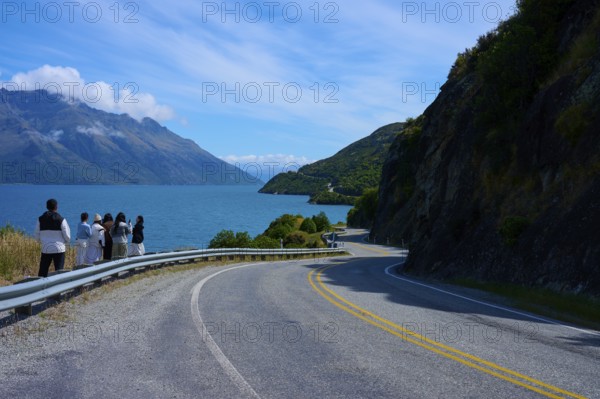 Travellers enjoy the view of the lake and mountains, Devil's Staircase Lookout Point, Kingston,