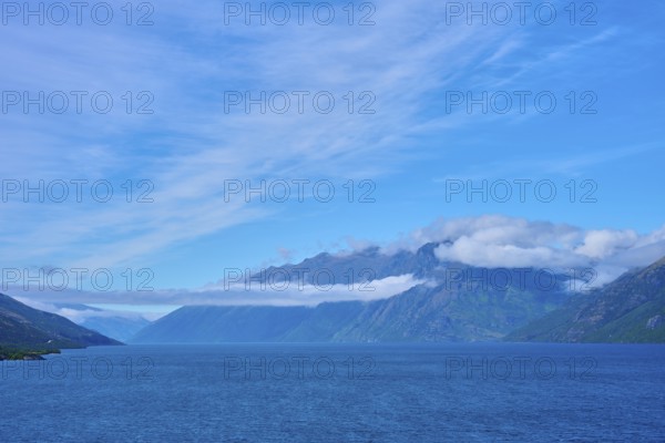 Tranquil landscape with mountains, blue lake and slightly cloudy sky, Drift Bay, Lake Wakatipu,
