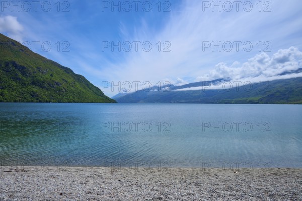 Peaceful beach landscape with blue sky and calm water, Kingston, Queenstown-Lakes District, Otago,
