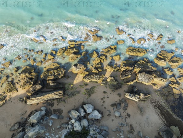 The Roche coves at he Mediterranean Sea. Aerial view. Drone shot. Cádiz province, Andalusia, Spain