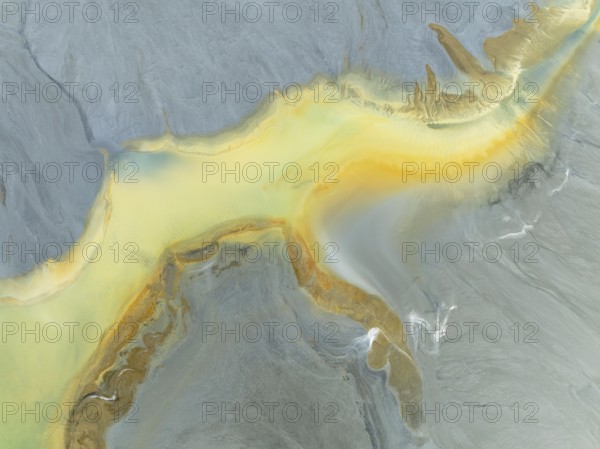 Abstract patterns in a waste pond in the mineral-rich area of the Rio Tinto mines. The colour is