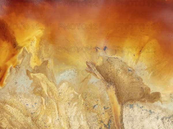 Abstract patterns in a pool in the mineral-rich area of the Rio Tinto mines. The colour is caused