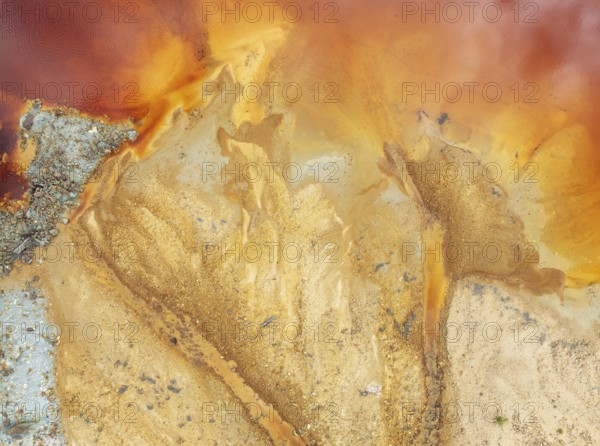 Abstract patterns in a pool in the mineral-rich area of the Rio Tinto mines. The colour is caused