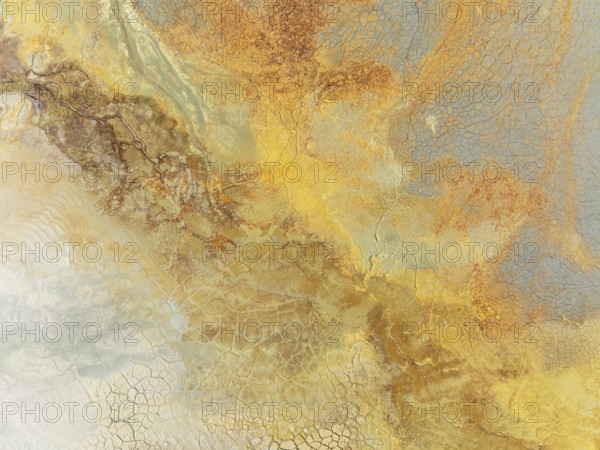 Abstract patterns in a waste pond in the mineral-rich area of the Rio Tinto mines. The colour is