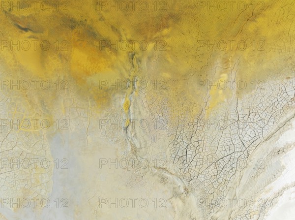 Abstract patterns in a waste pond in the mineral-rich area of the Rio Tinto mines. The colour is