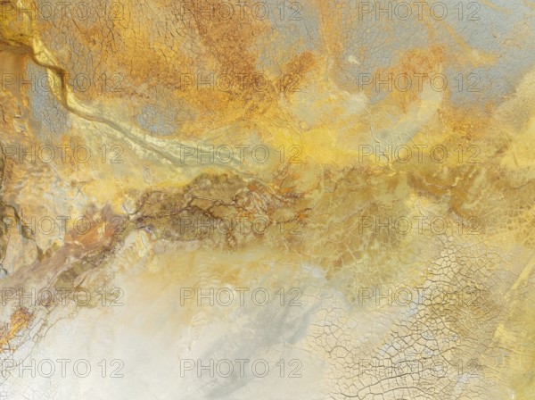 Abstract patterns in a waste pond in the mineral-rich area of the Rio Tinto mines. The colour is
