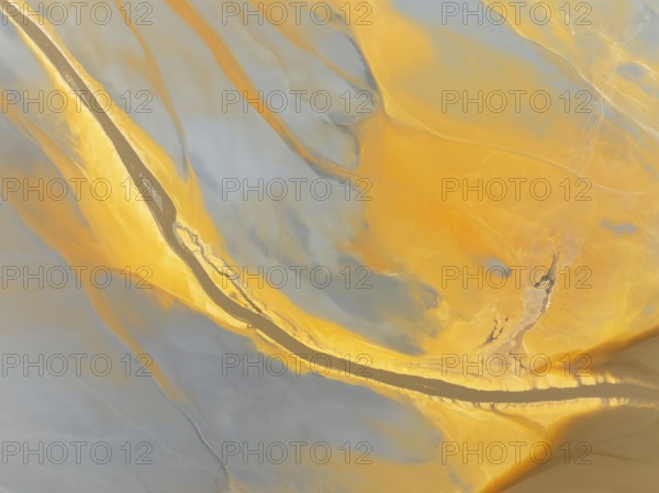 Abstract patterns in a waste pond in the mineral-rich area of the Rio Tinto mines. The colour is