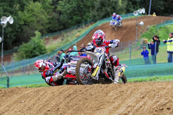 Motocross, Rudersberg, Baden-Württemberg, Germany, Europe, A motorbike rider with passenger rides