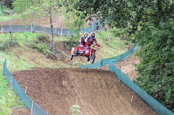 Motocross, Rudersberg, Baden-Württemberg, Germany, Europe, Two riders on a motorbike jump over a