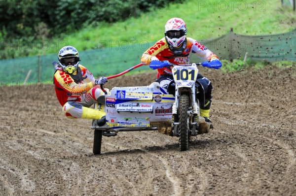 Motocross, Rudersberg, Baden-Württemberg, Germany, Europe, Rider with sidecar races through muddy