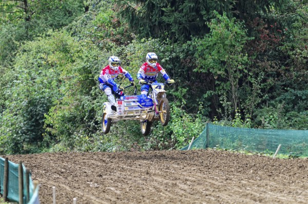 Motocross, Rudersberg, Baden-Württemberg, Germany, Europe, Two riders with sidecars jump over a