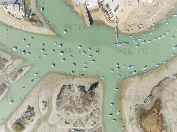 Fishing boats at low tide at the fishing village of Sancti Petri. In the marshland of the Bahía de