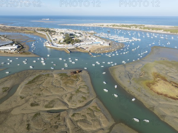 Network of channels and streams at low tide and the fishing village of Sancti Petri at the Atlantic