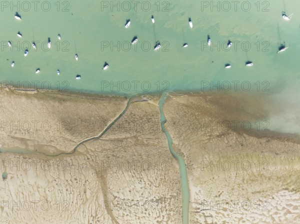 Sports and fishing boats at low tide near the fishing village of Sancti Petri. In the marshland of