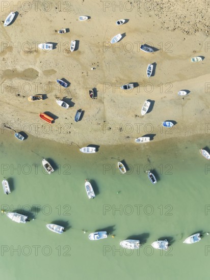 Fishing boats at low tide at the fishing village of Sancti Petri. In the marshland of the Bahía de