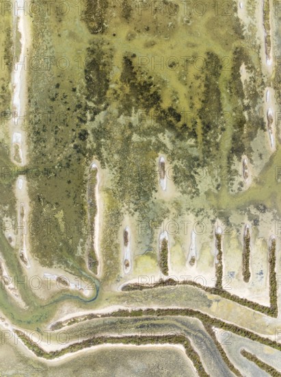 Abandoned saline ponds in the Bahía de Cádiz Nature Reserve. Aerial view. Drone shot. Cádiz