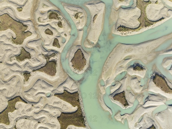 Network of channels and streams at low tide. In the marshland of the Bahía de Cádiz Nature Reserve.