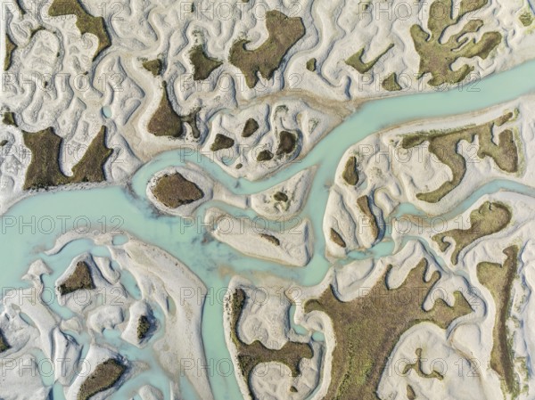 Network of channels and streams at low tide. In the marshland of the Bahía de Cádiz Nature Reserve.