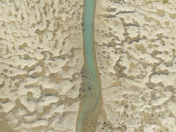 Network of channels and streams at low tide. In the marshland of the Bahía de Cádiz Nature Reserve.
