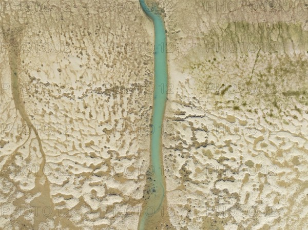 Network of channels and streams at low tide. In the marshland of the Bahía de Cádiz Nature Reserve.