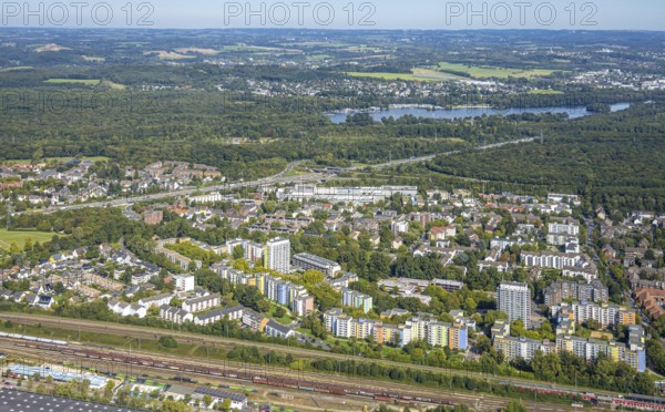 Aerial view, residential area district Hassels with high-rise buildings and view to Unterbacher