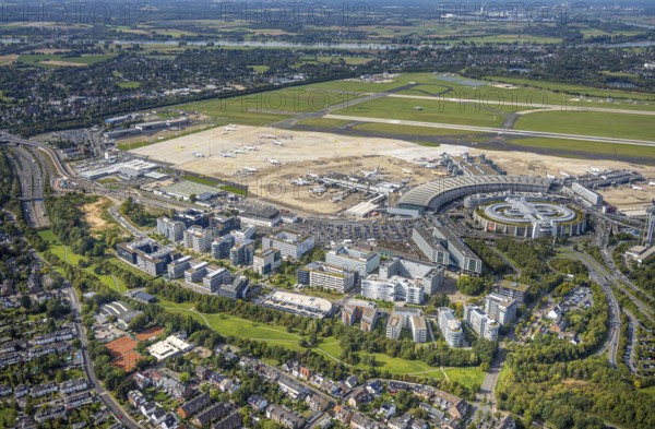 Aerial view, DUS Airport Düsseldorf with terminal building and apron, commercial area DUS