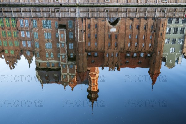 Waterfront promenade with reflection at sunrise in the Old Town, Motlawa River, Gdansk, Gdansk,
