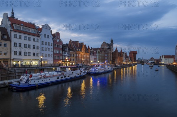 Illuminated promenade at sunset in the Old Town, Motlawa River, Gdansk, Poland